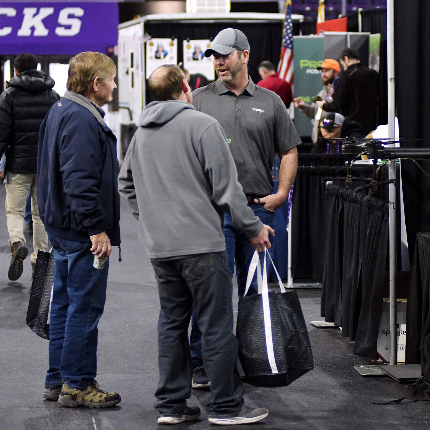networking Networking between an exhibitor and attendees of the 2026 MN Ag Expo trade show in Mankato, Mn.